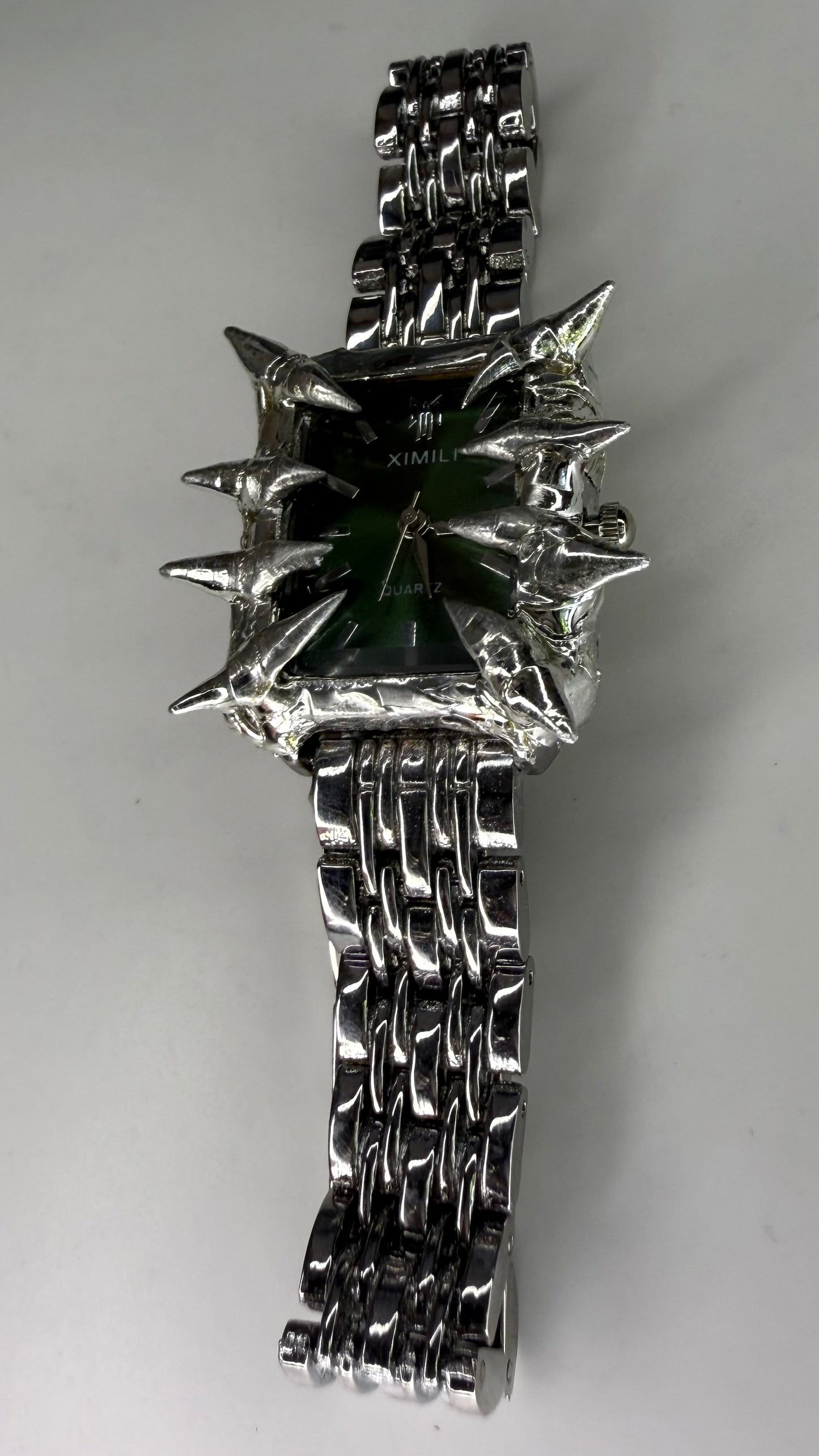 Green spiked watch
