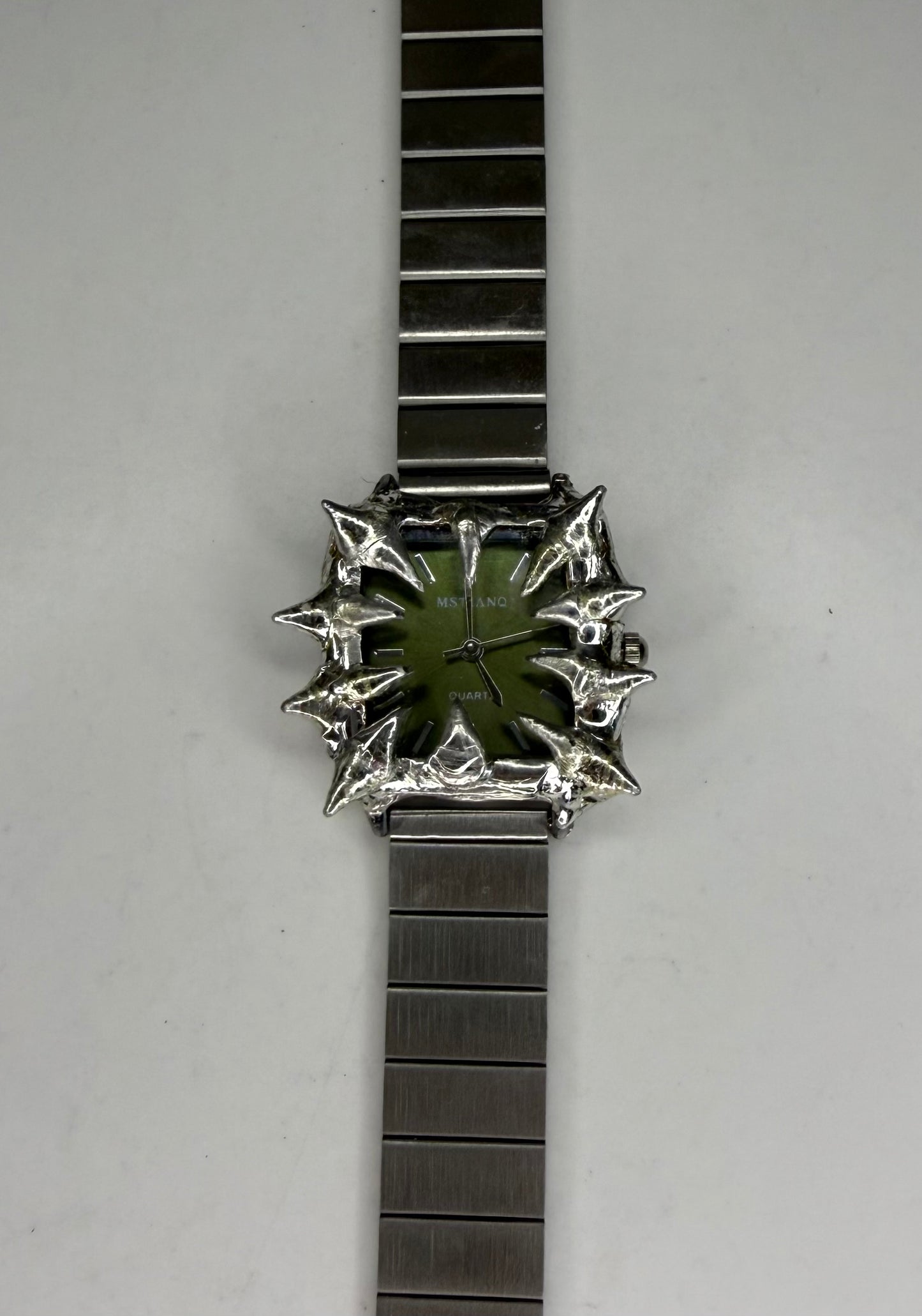 Green spiked watch