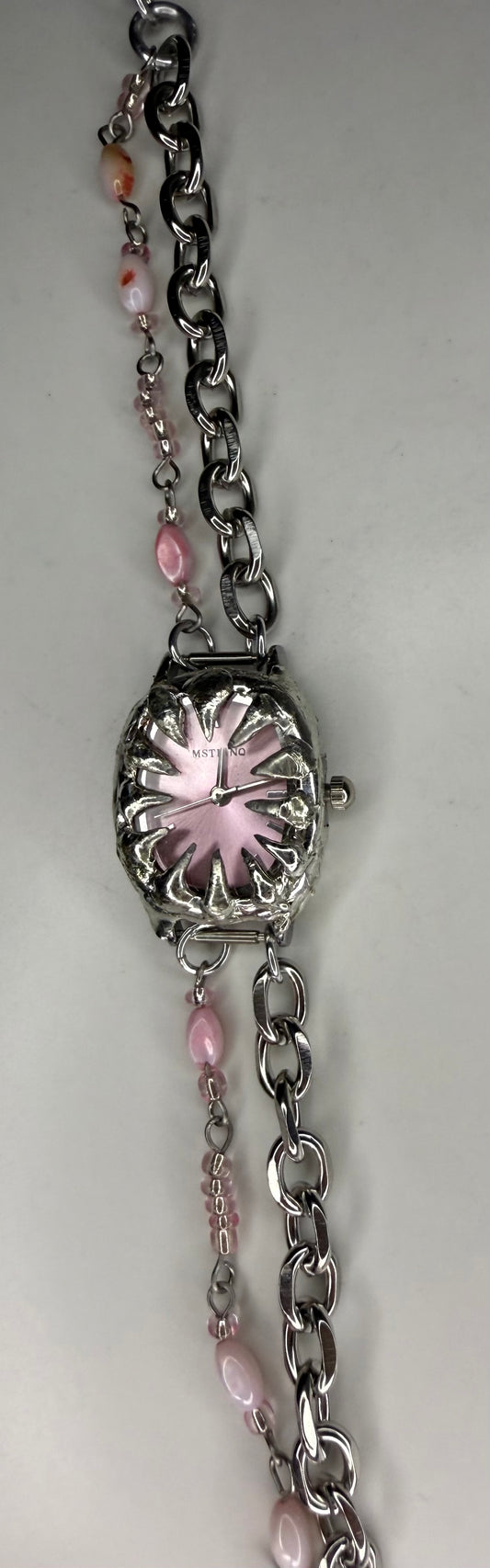 Pink spiked shell watch