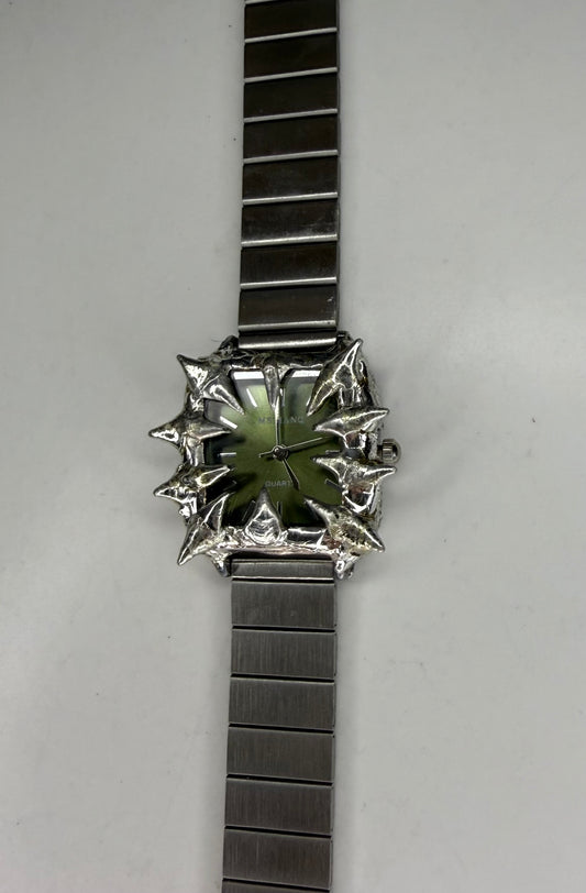 Green spiked watch