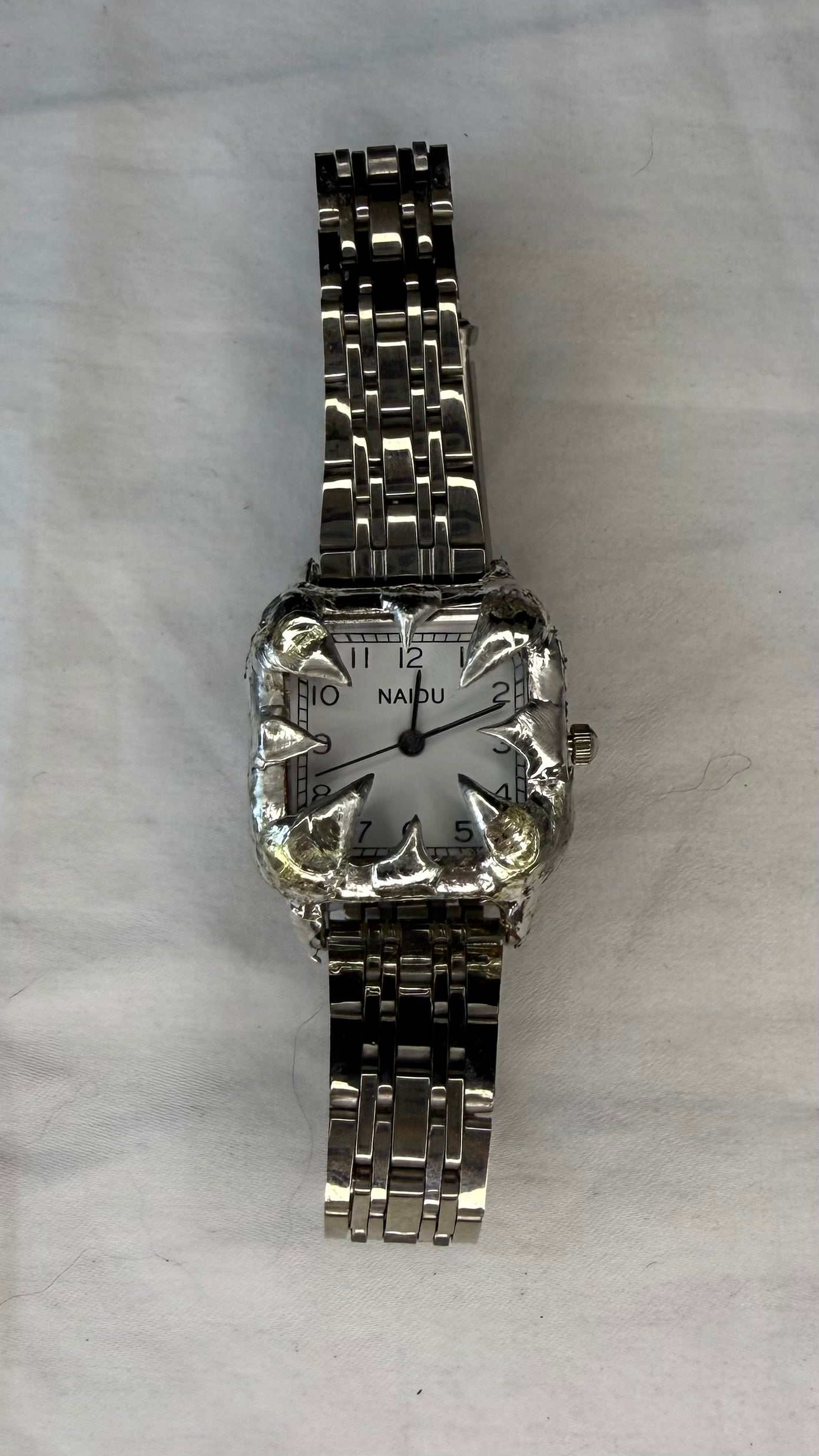 White spiked watch