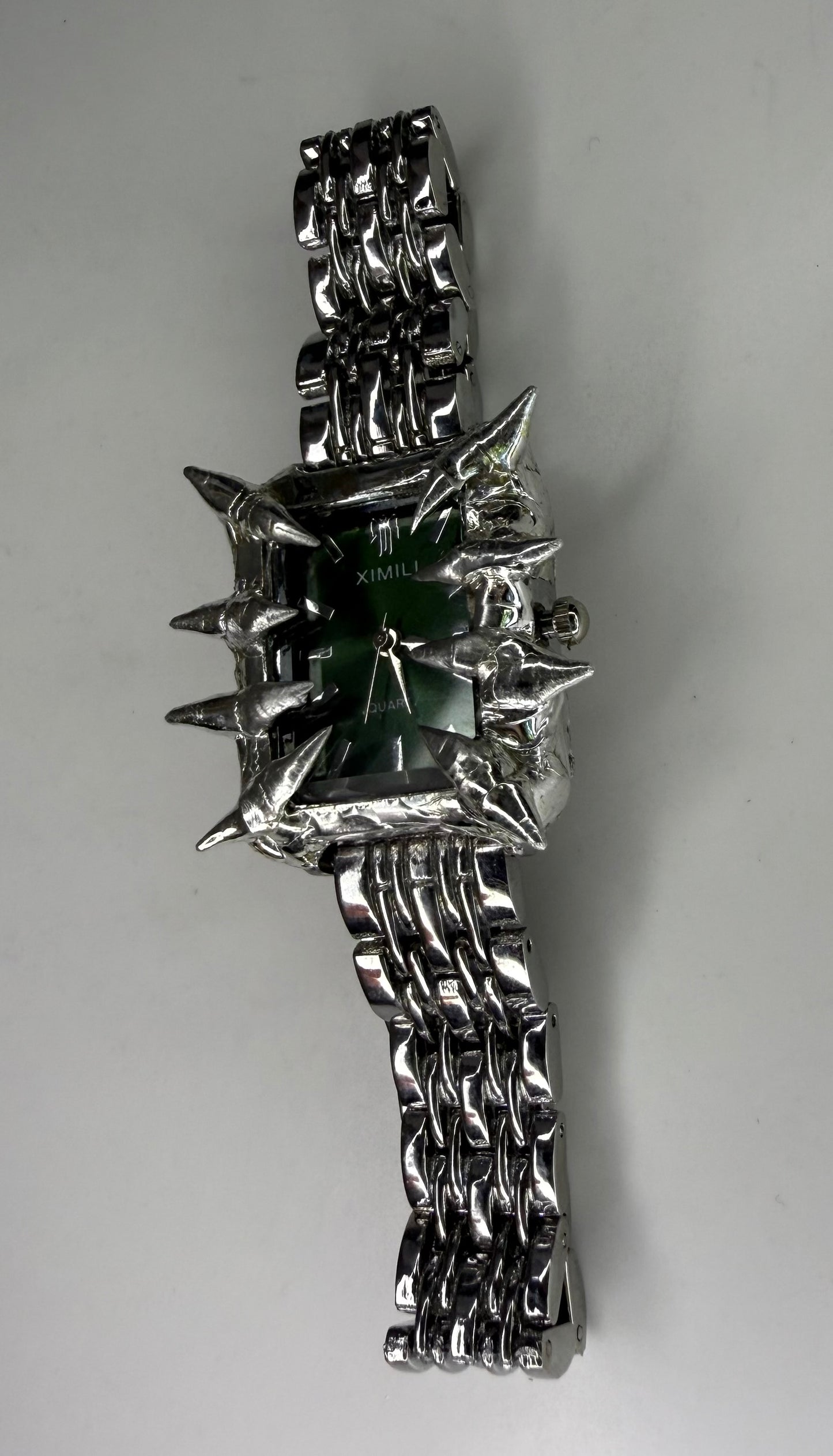 Green spiked watch
