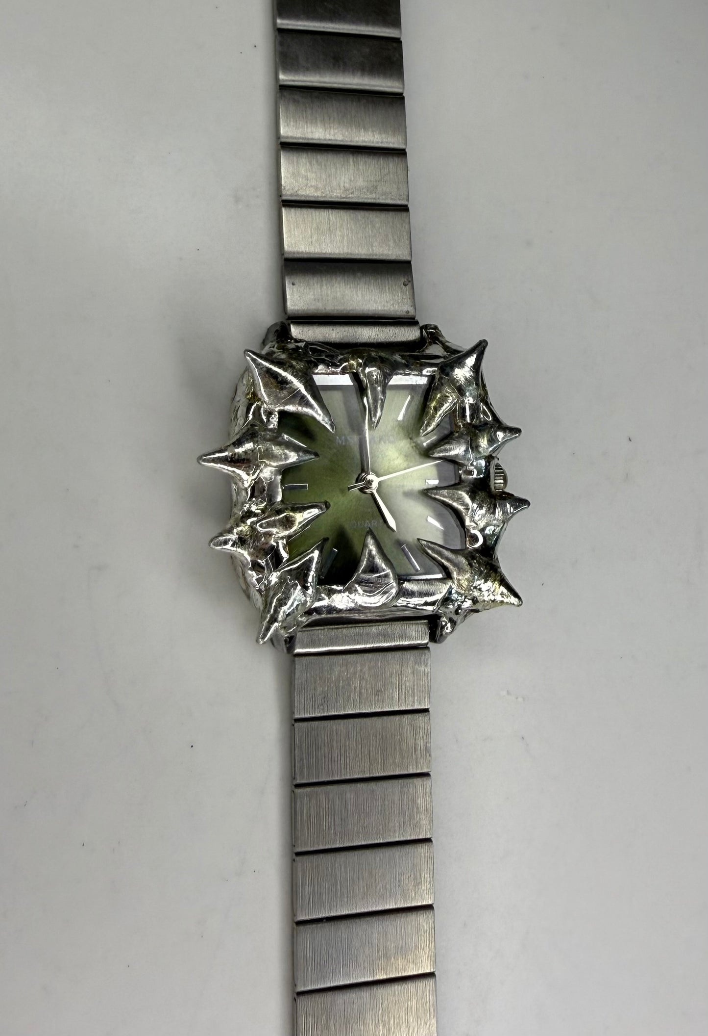 Green spiked watch