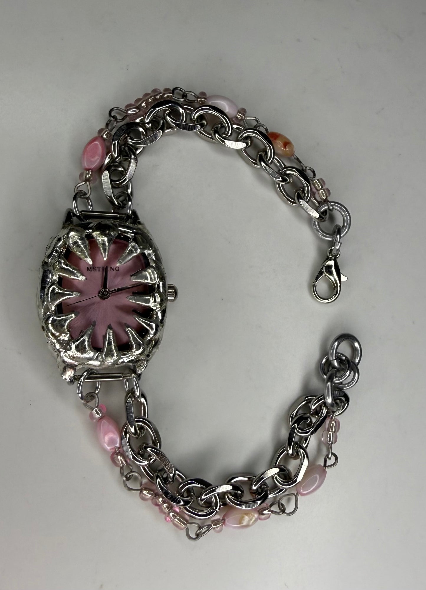 Pink spiked shell watch