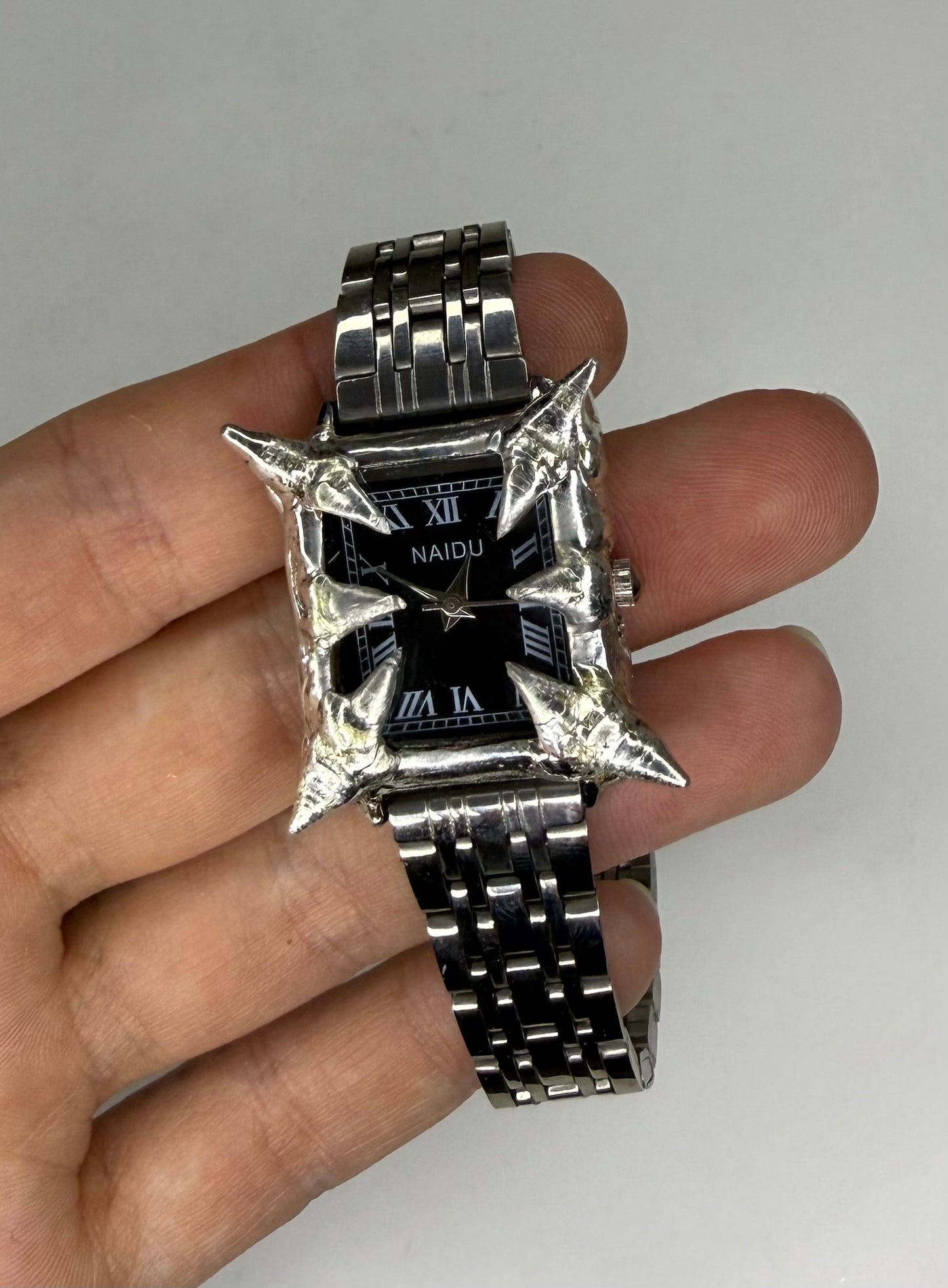 Black spiked watch