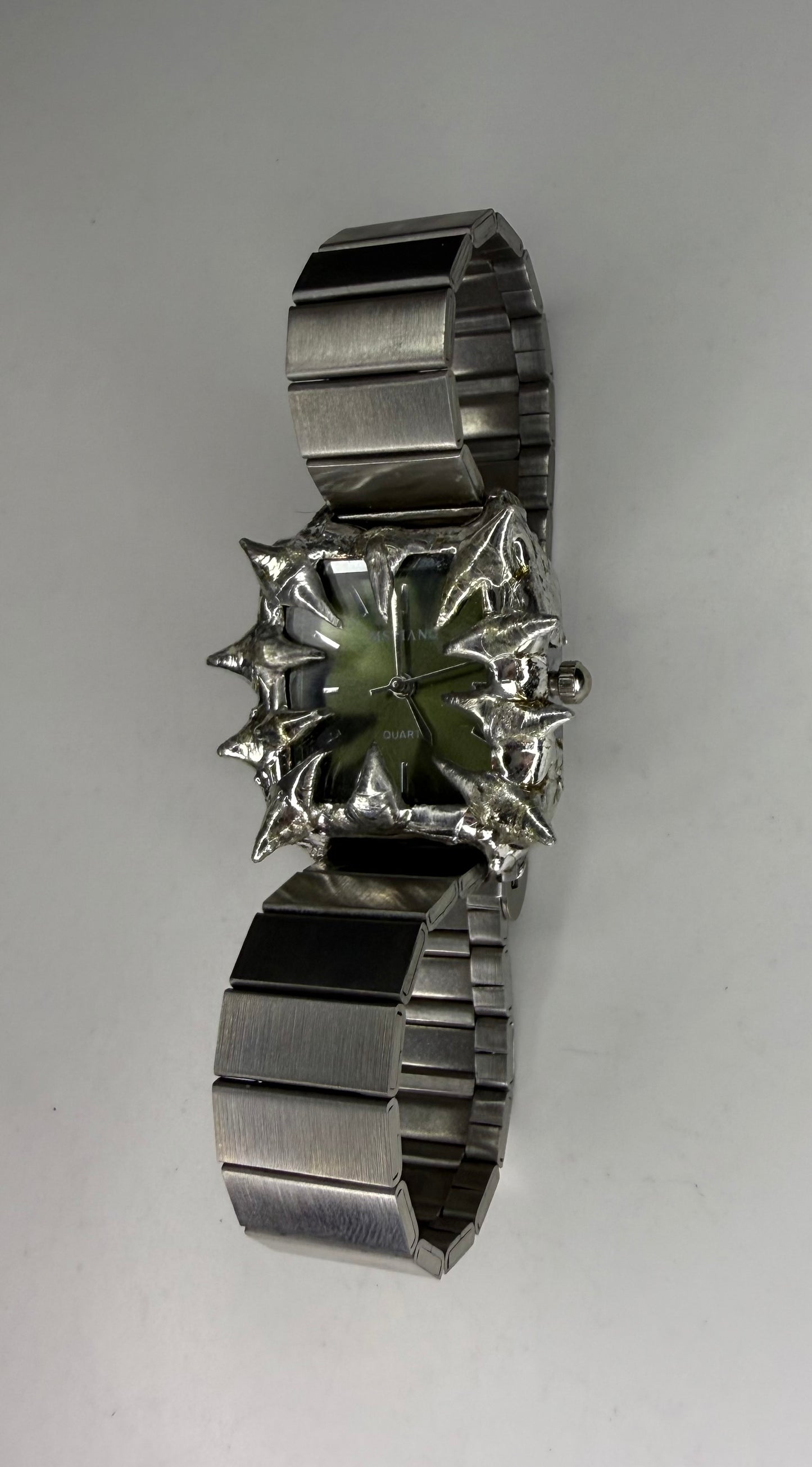 Green spiked watch
