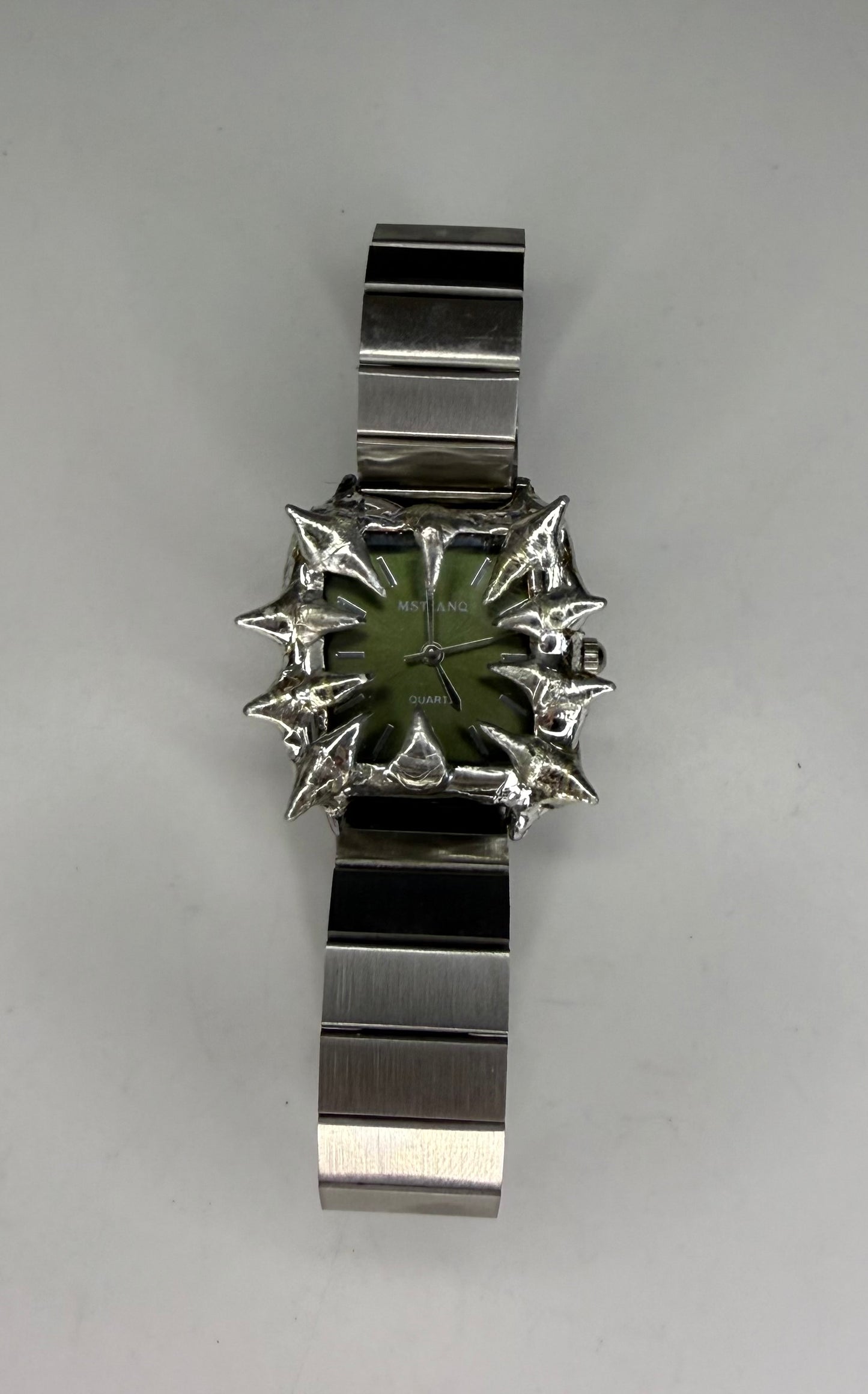 Green spiked watch
