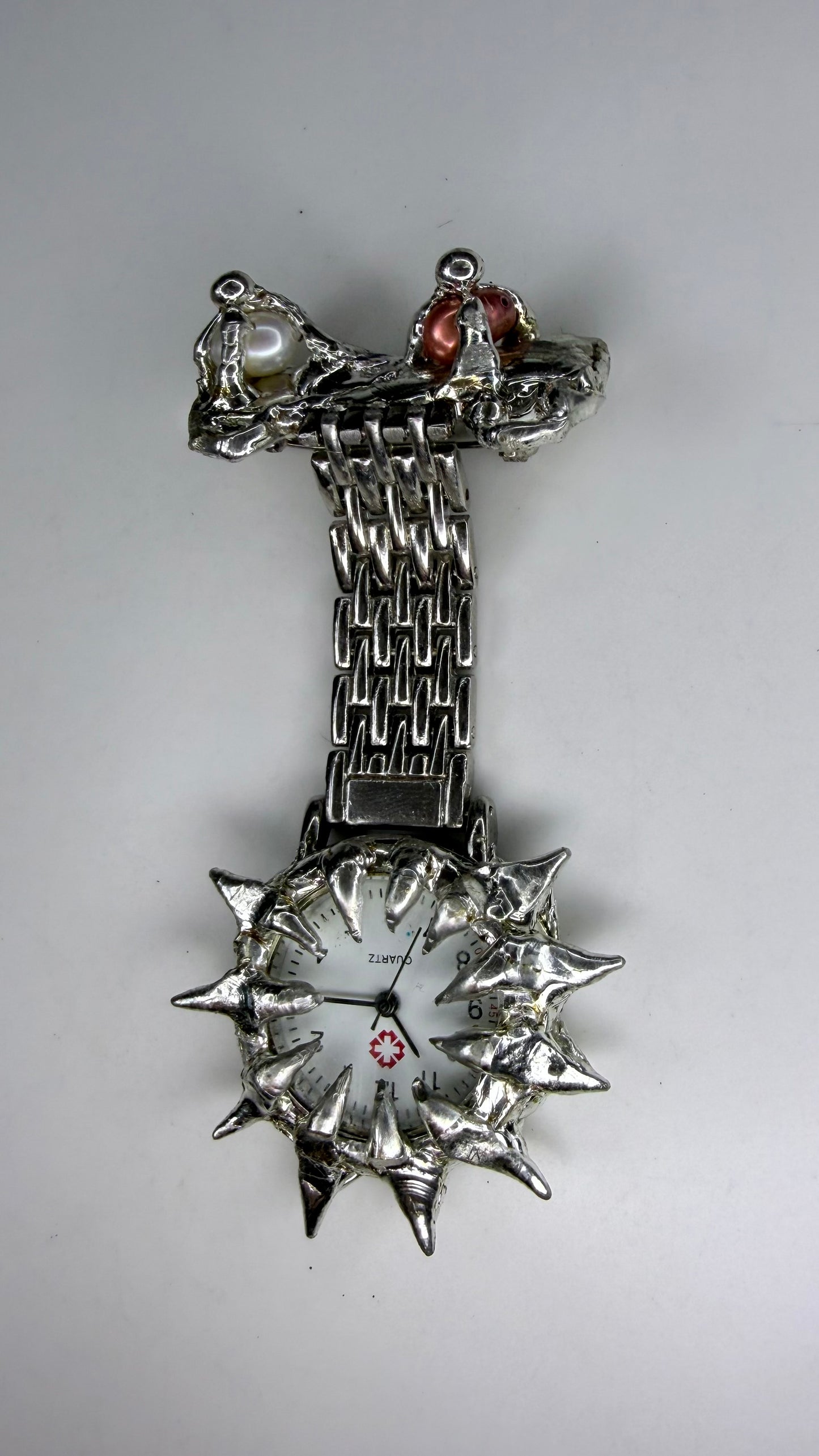 Spiked pearl broach watch