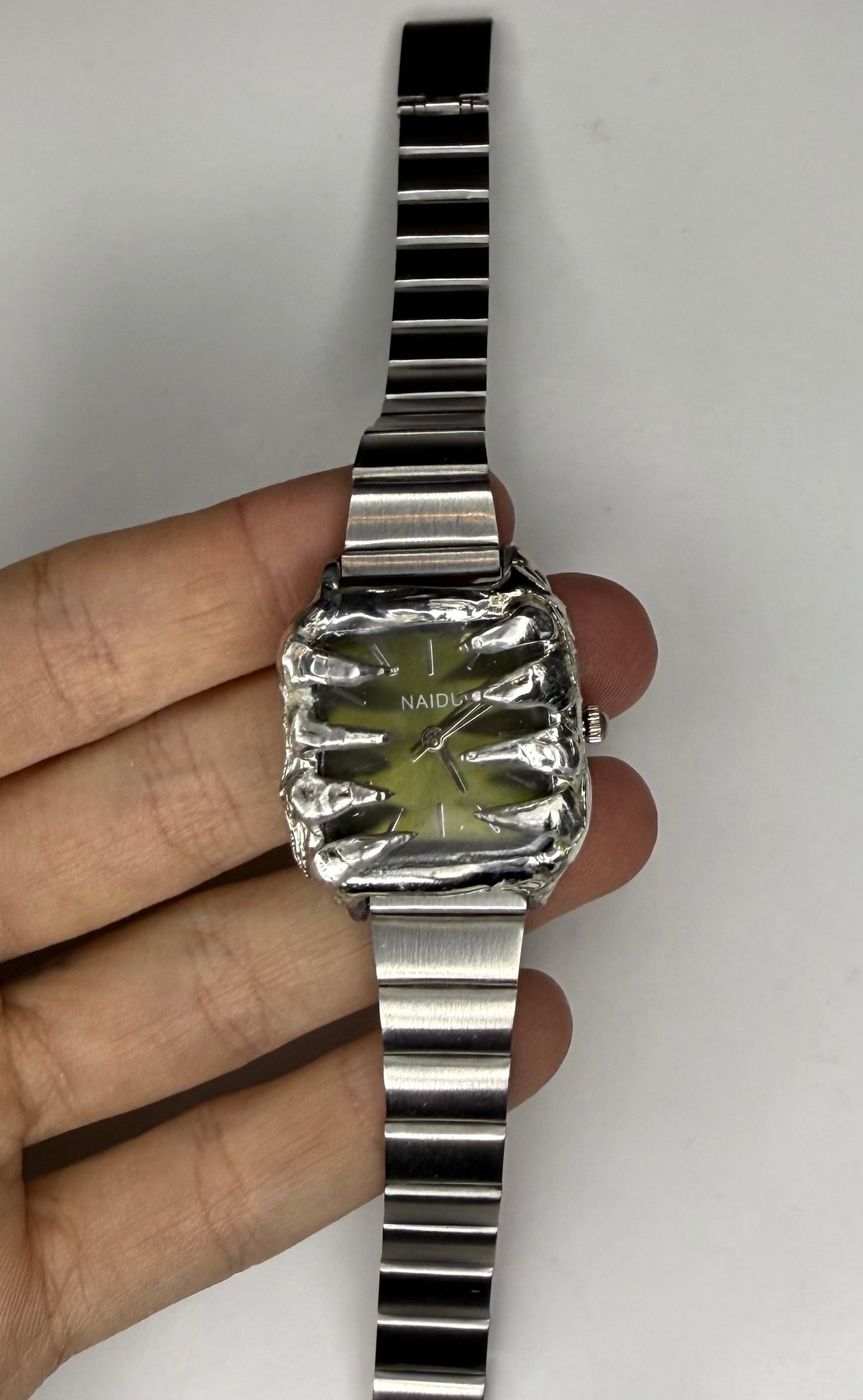 Green spiked watch