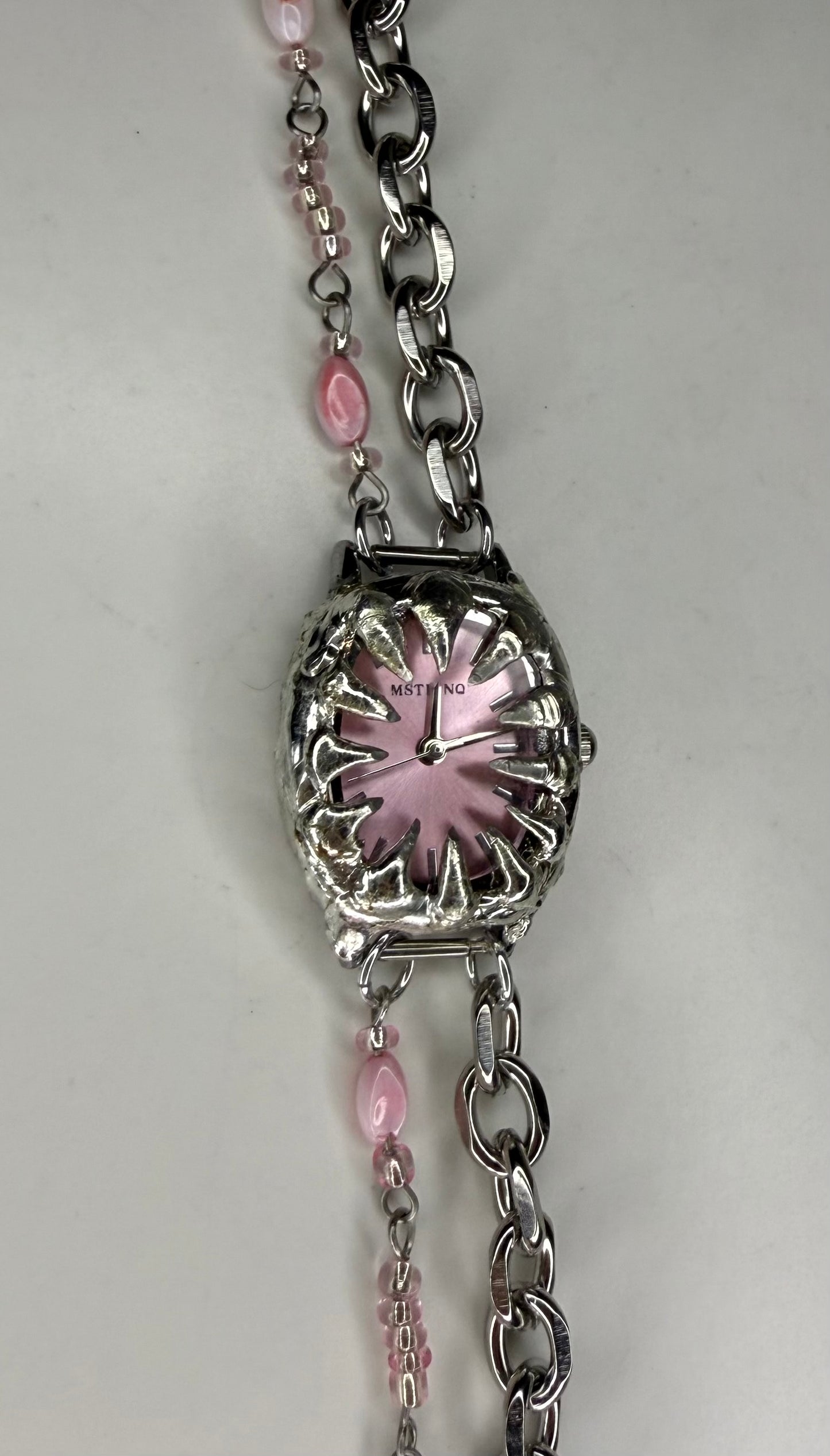 Pink spiked shell watch