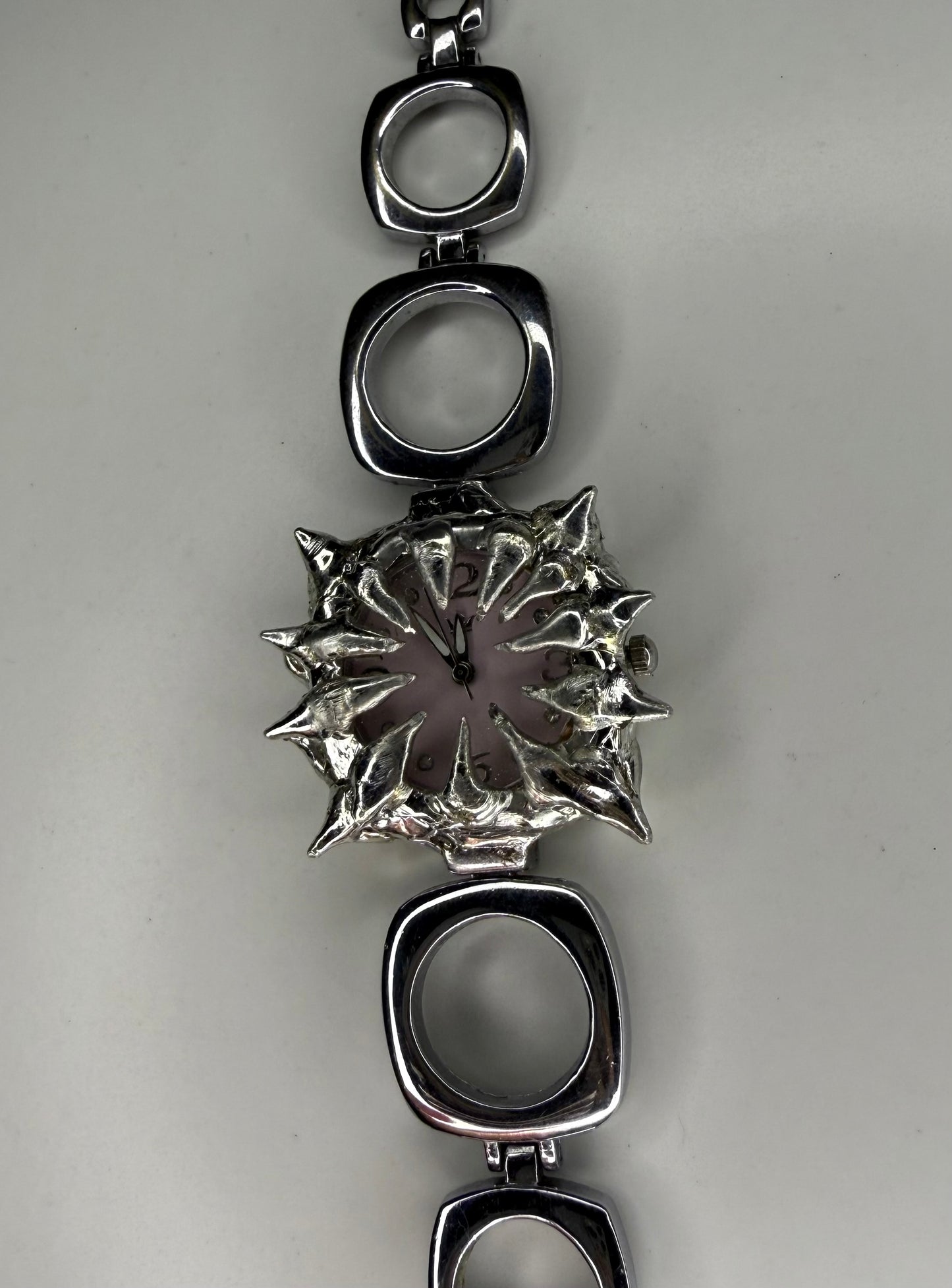 Pink spiked oval band watch