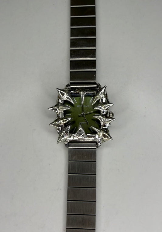 Green spiked watch