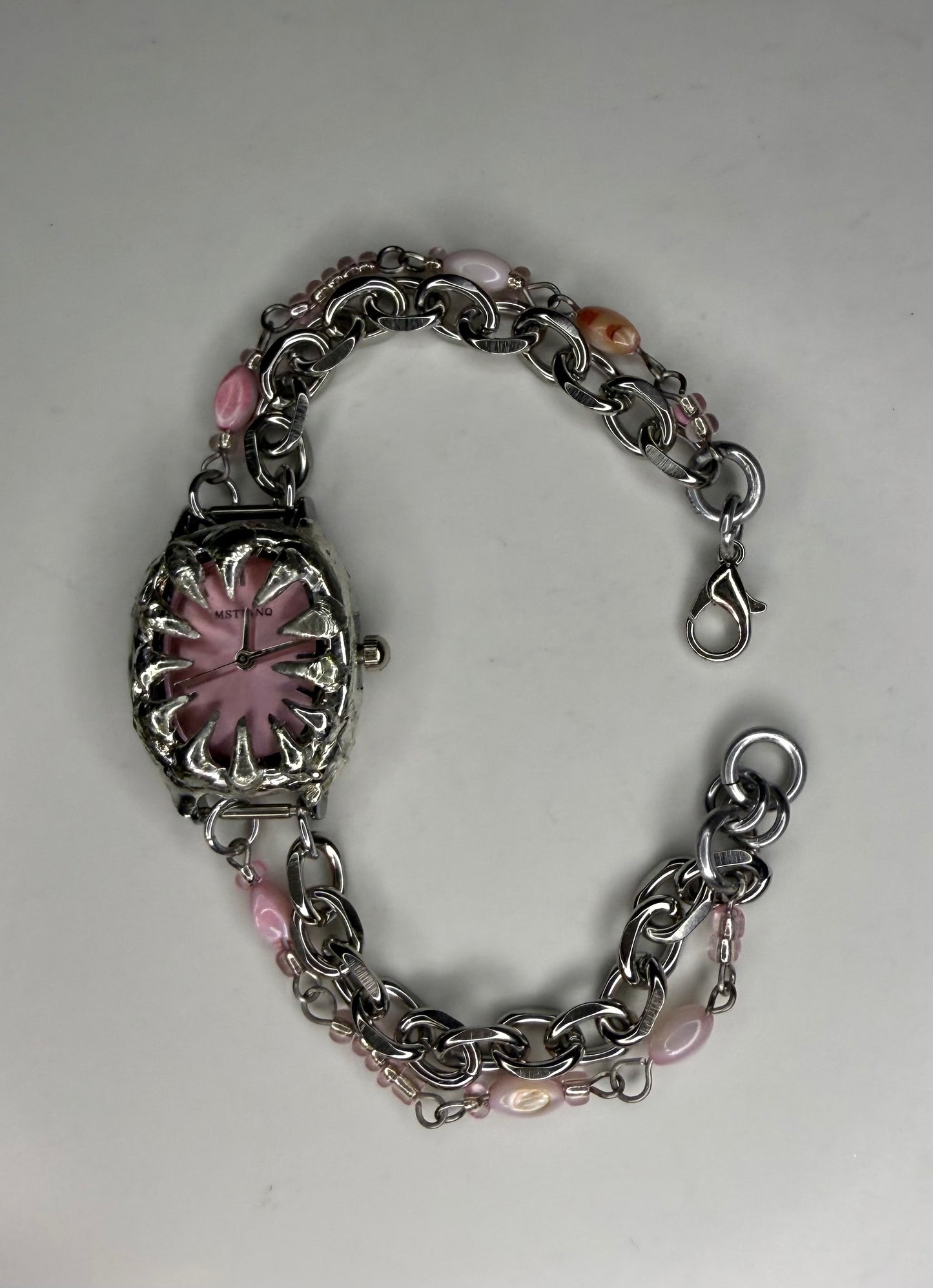 Pink spiked shell watch