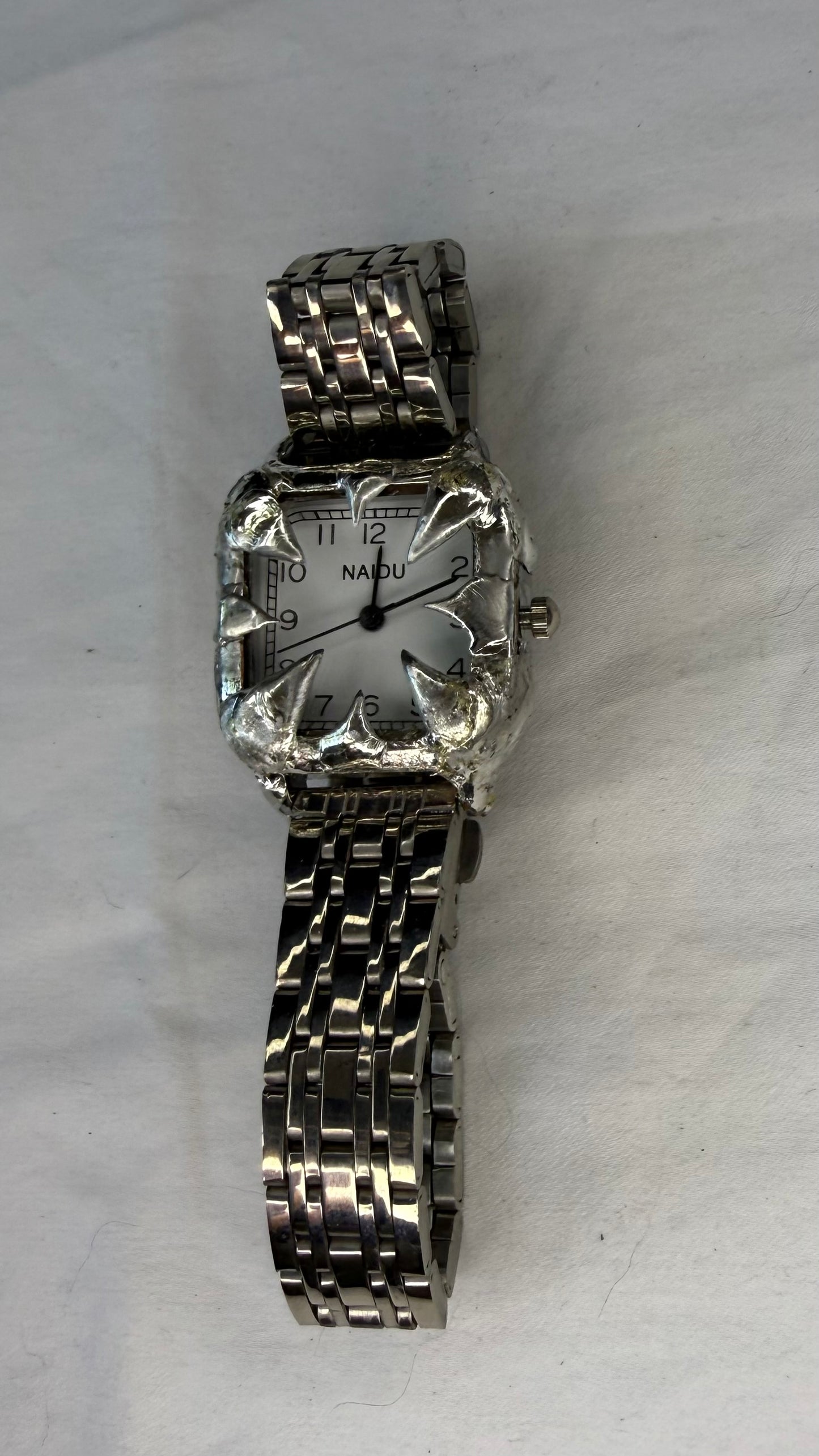 White spiked watch