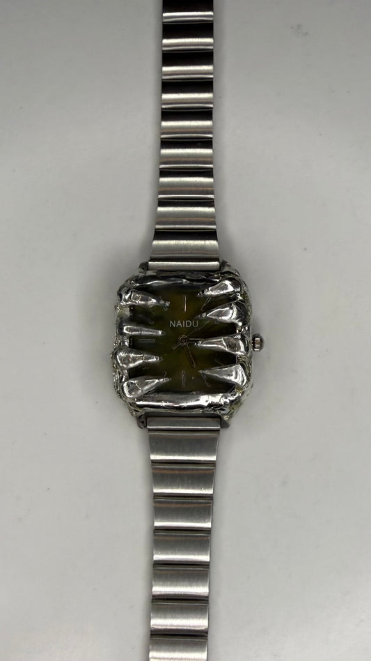 Green spiked watch