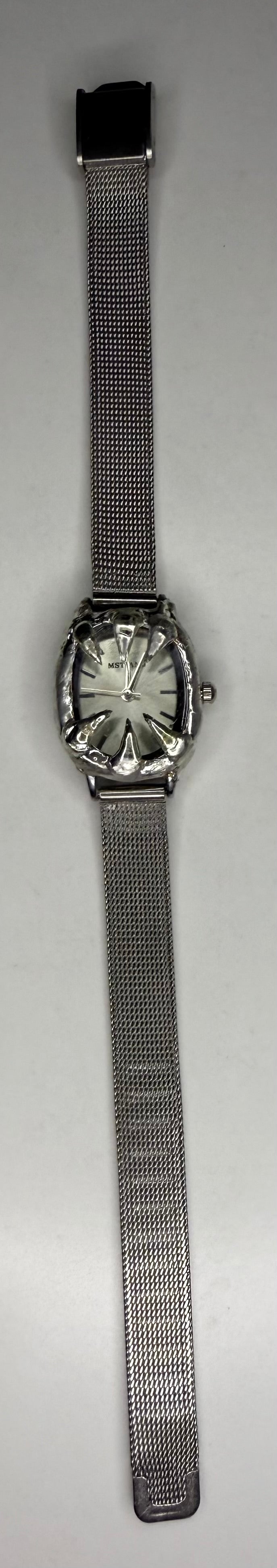 White spiked watch