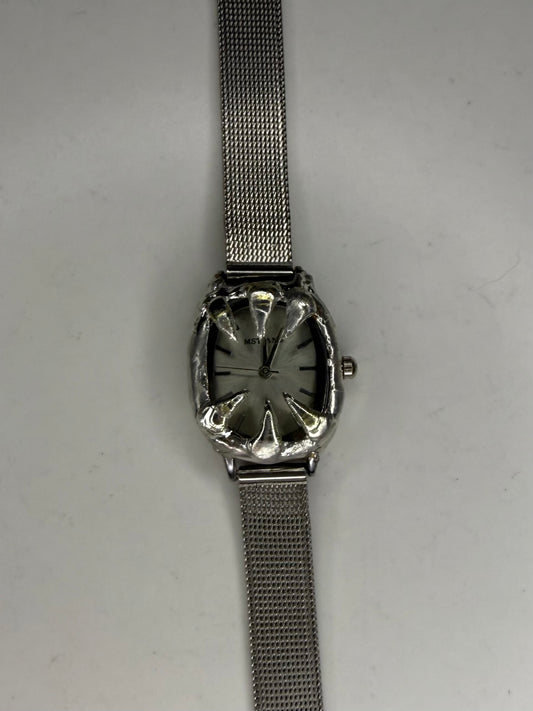 White spiked watch