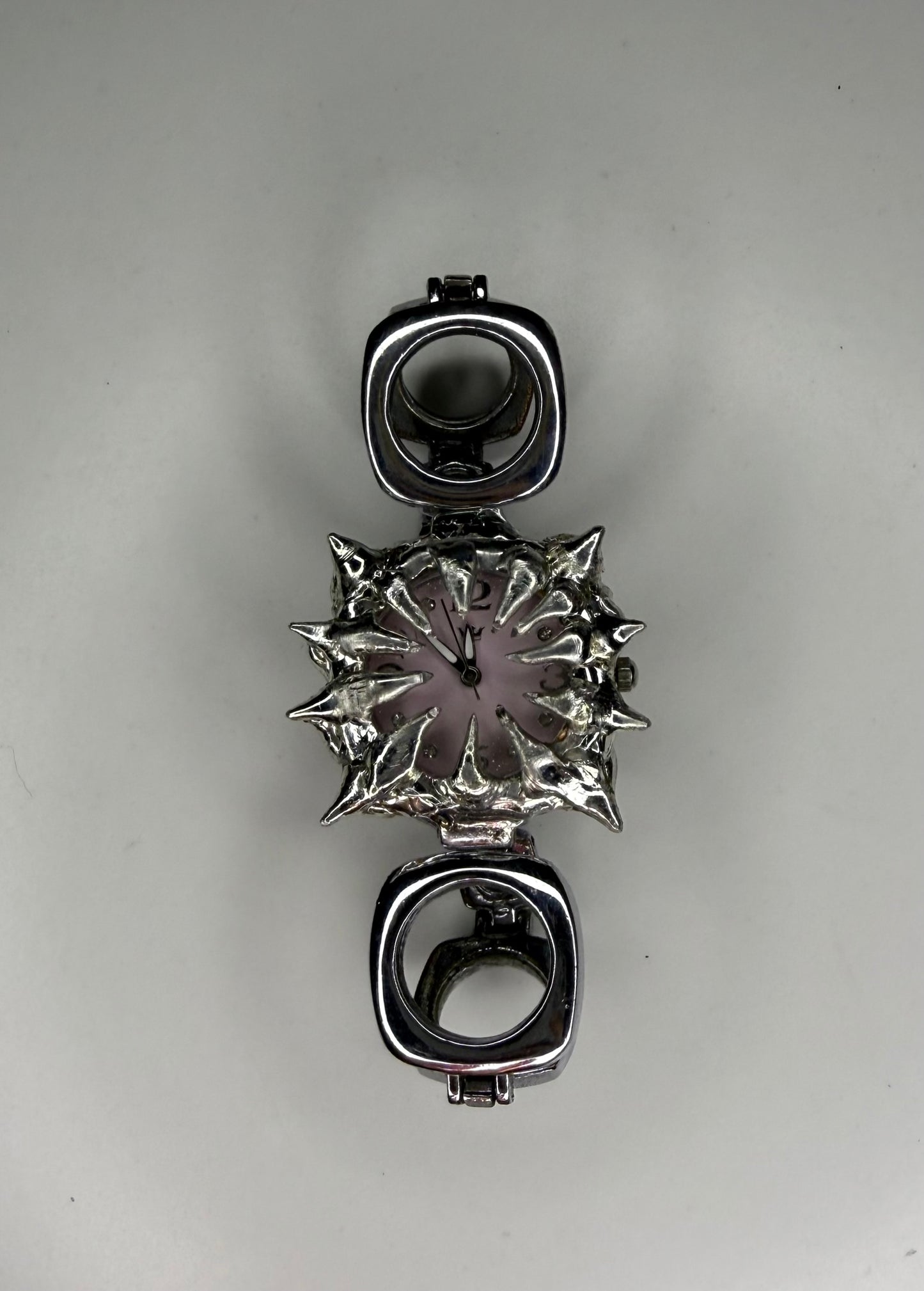 Pink spiked oval band watch