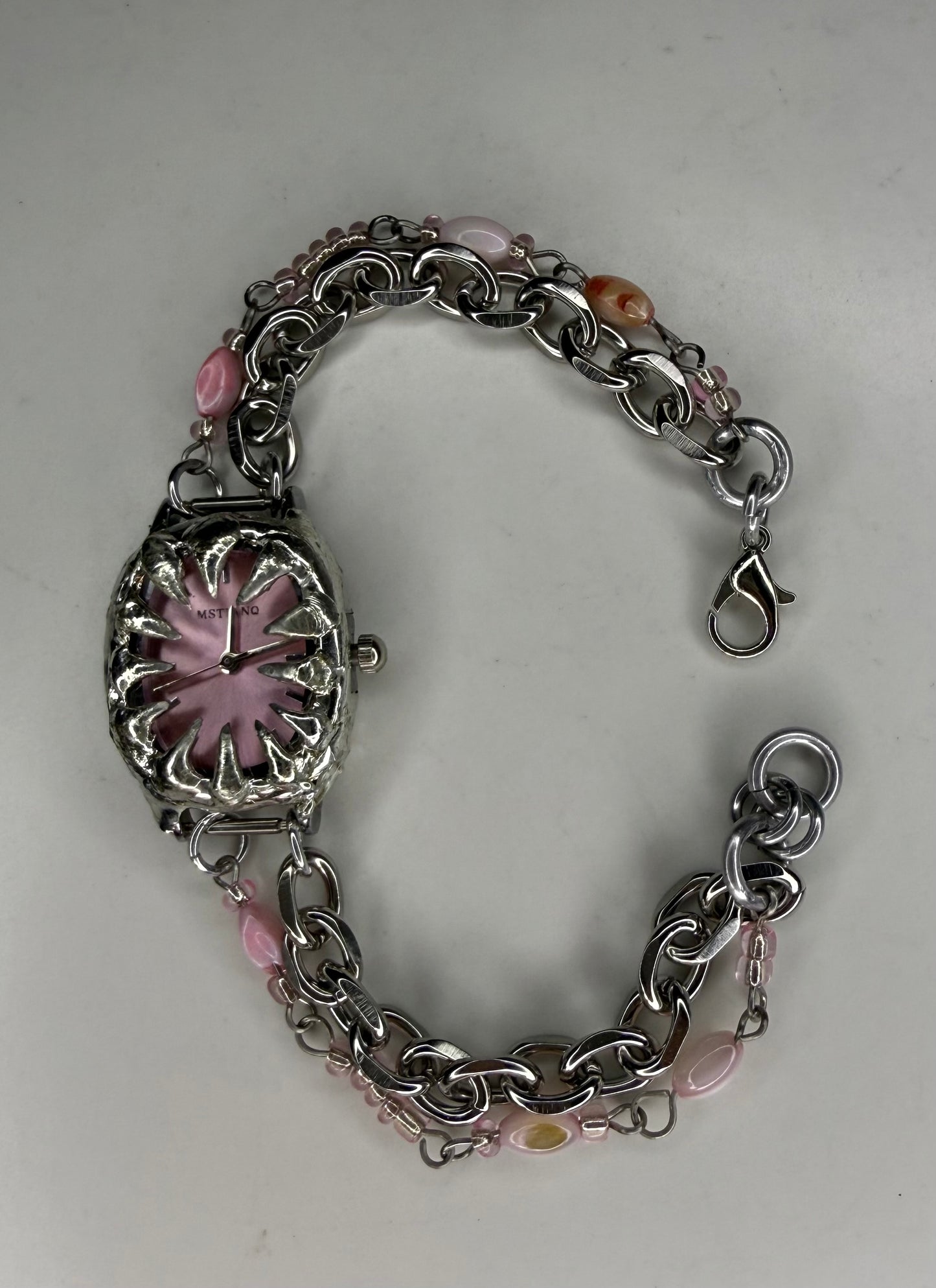 Pink spiked shell watch