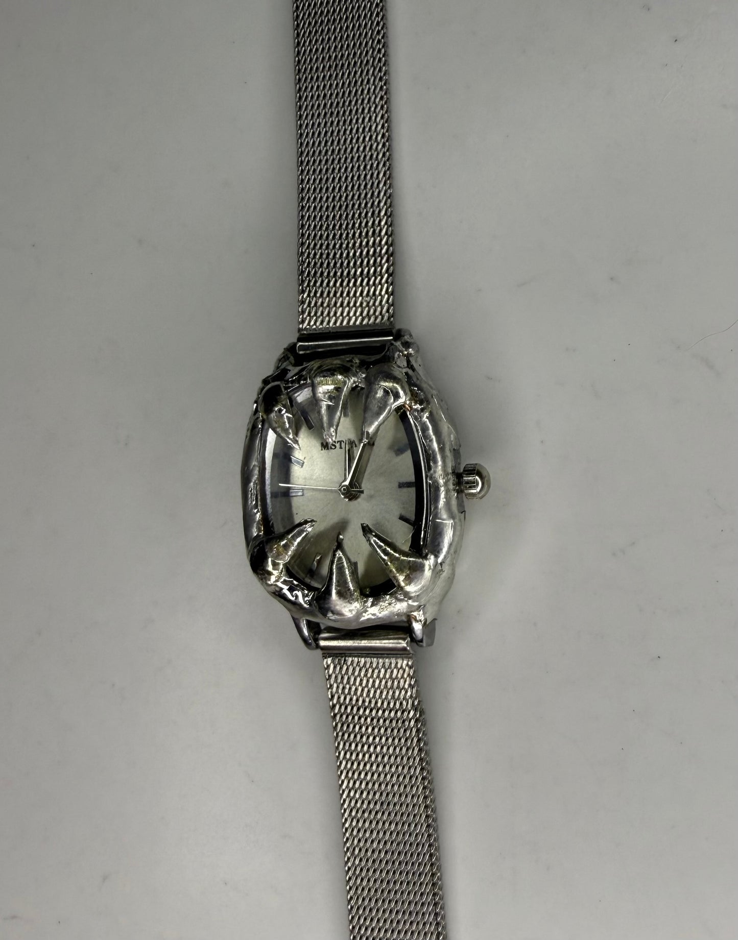 White spiked watch