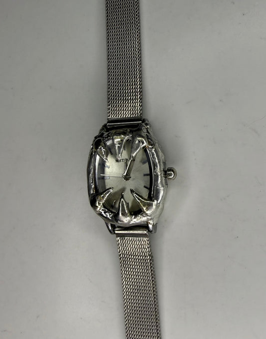 White spiked watch