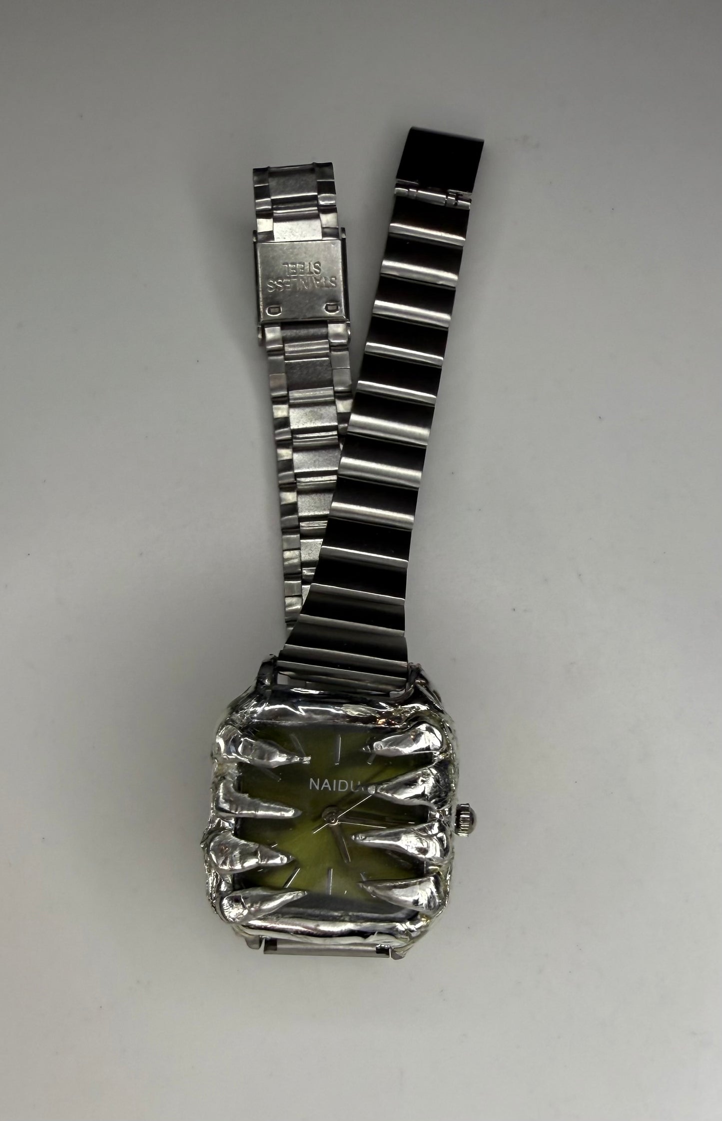 Green spiked watch