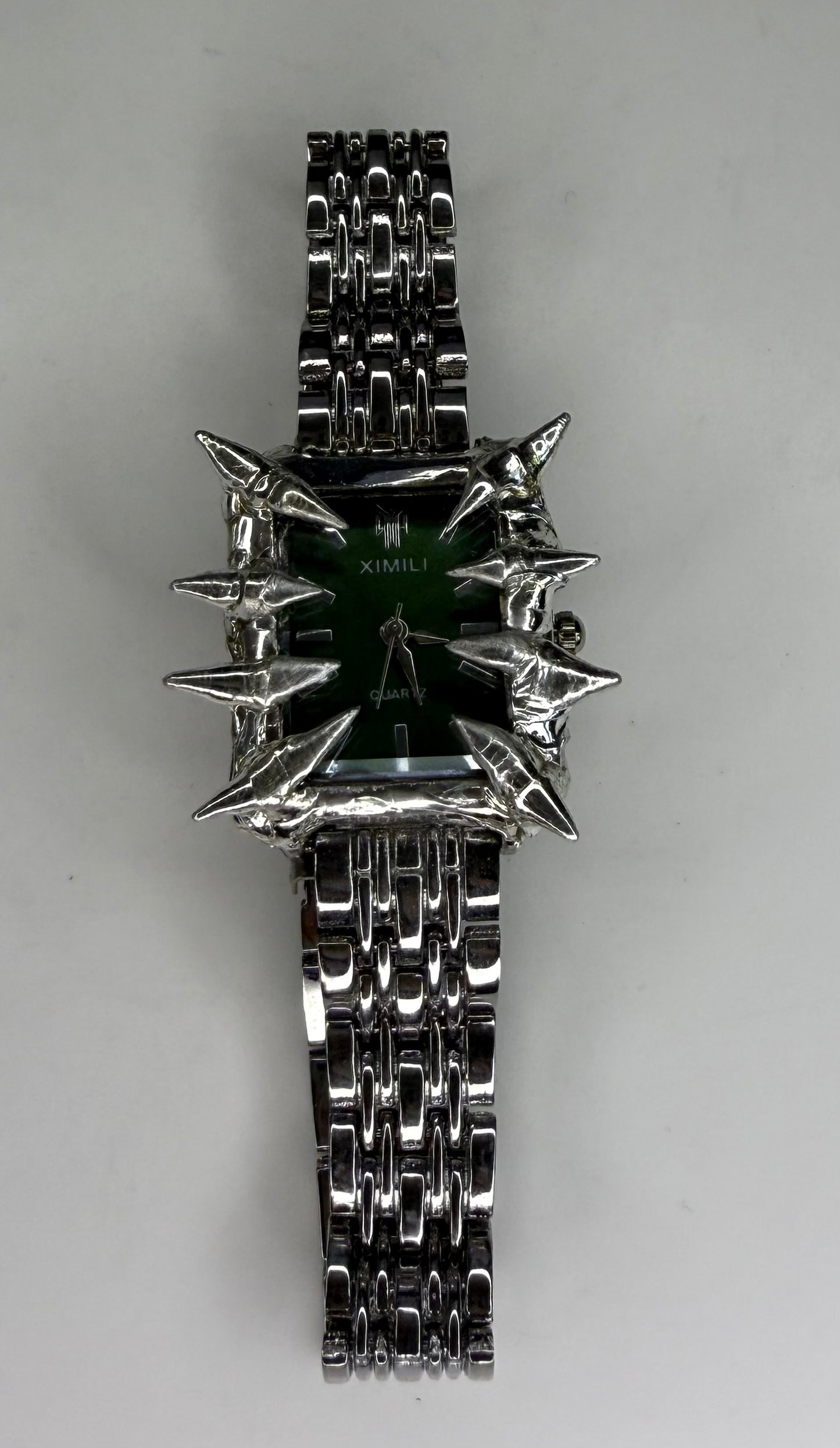 Green spiked watch