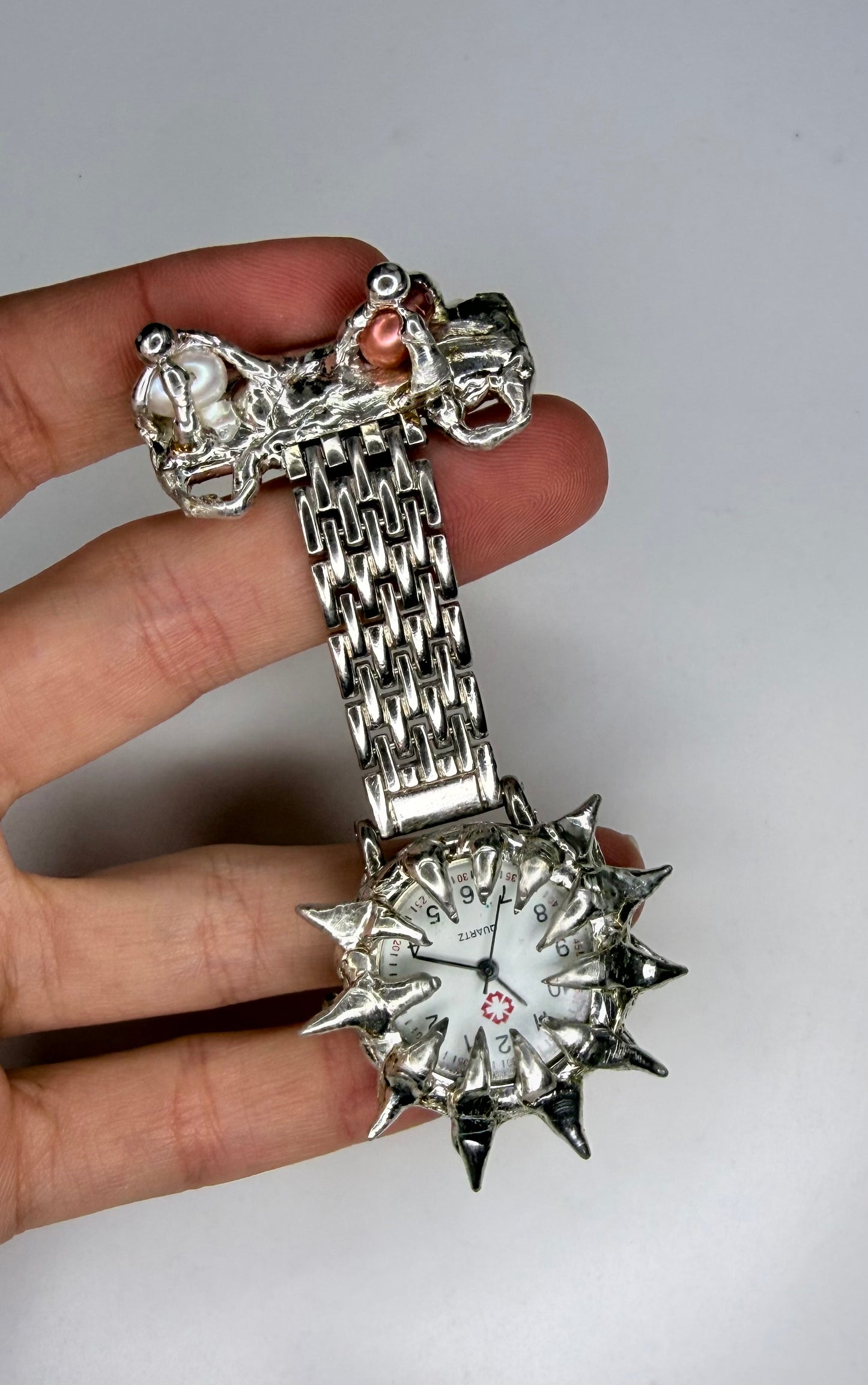 Spiked pearl broach watch