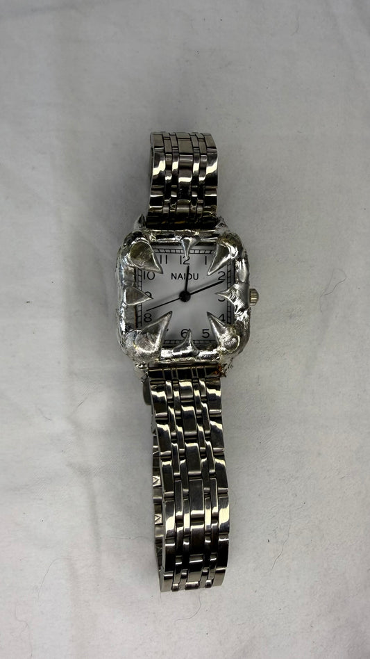 White spiked watch