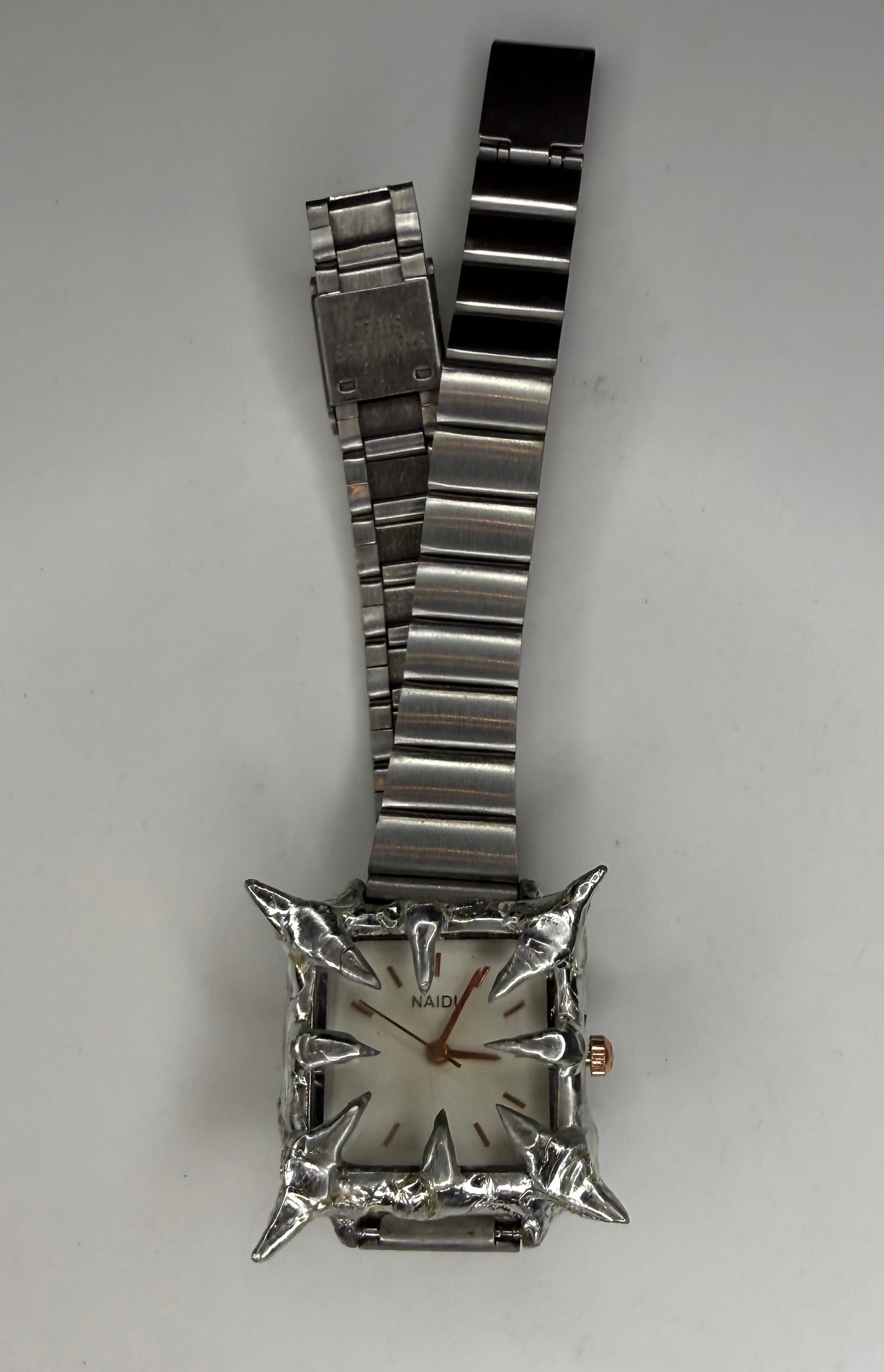 White spiked watch
