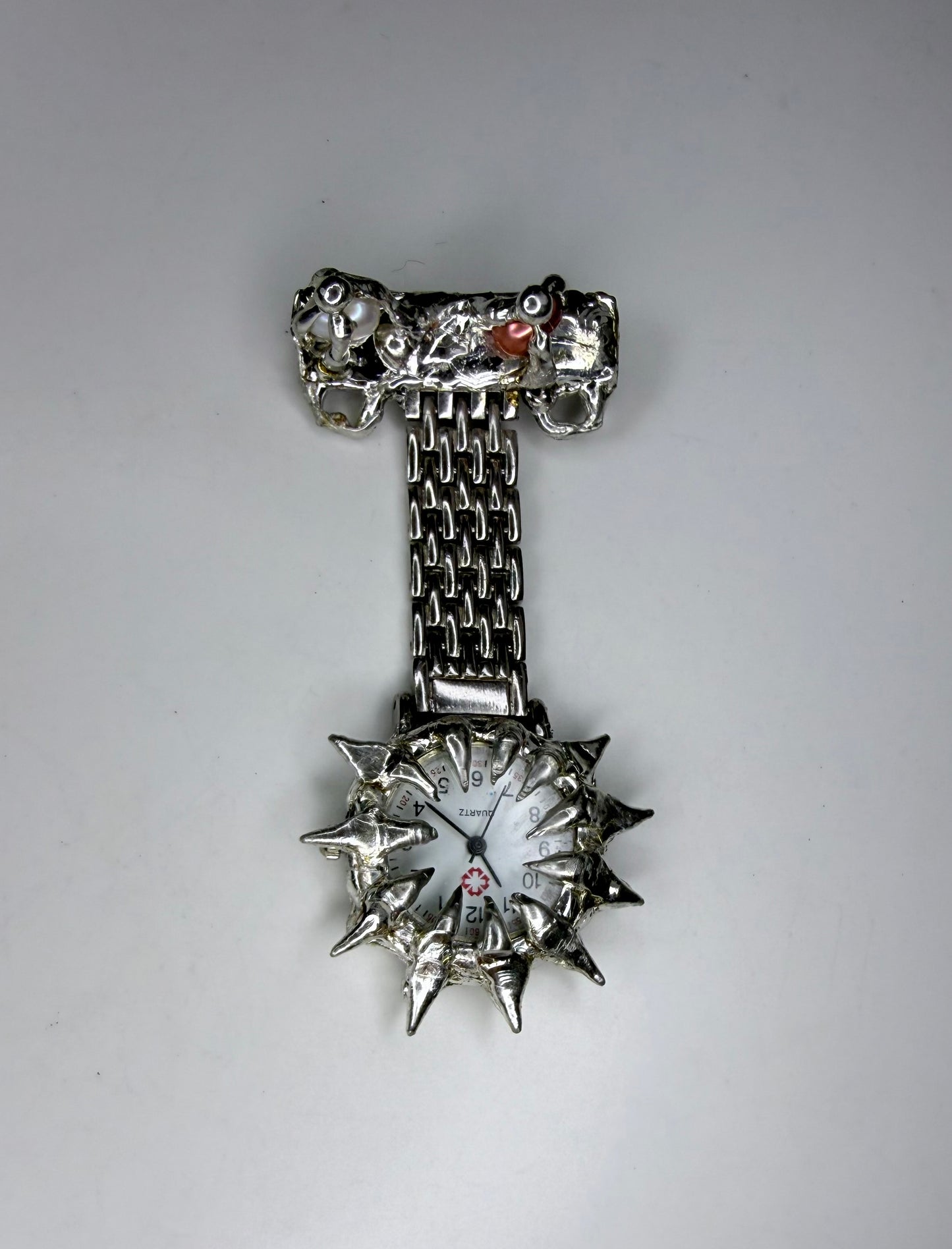 Spiked pearl broach watch