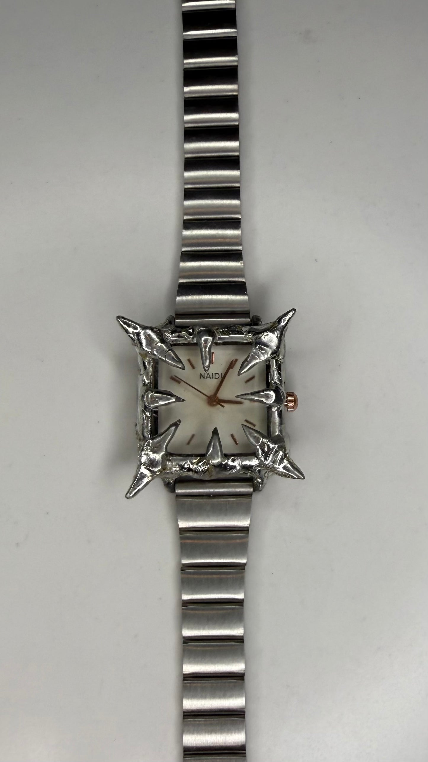White spiked watch