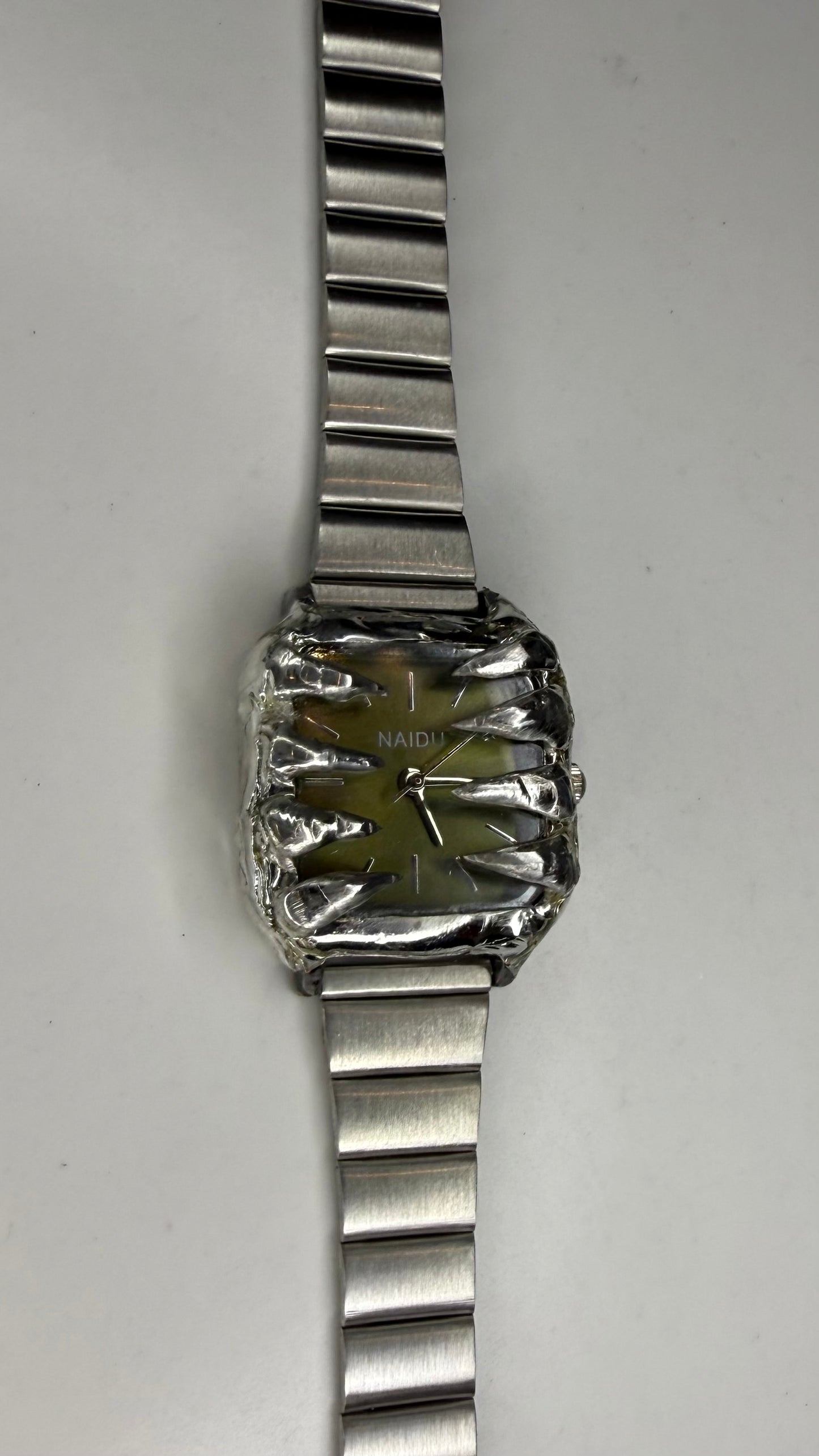 Green spiked watch