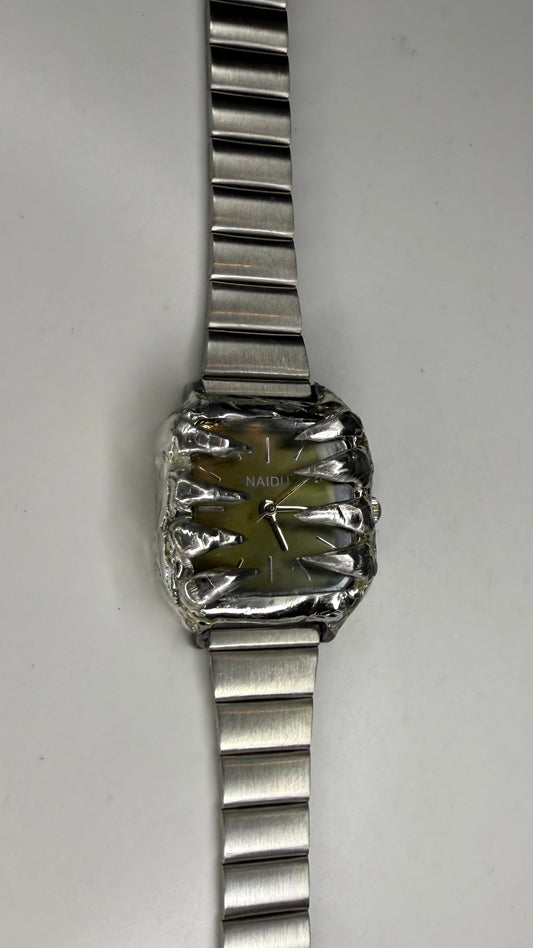 Green spiked watch