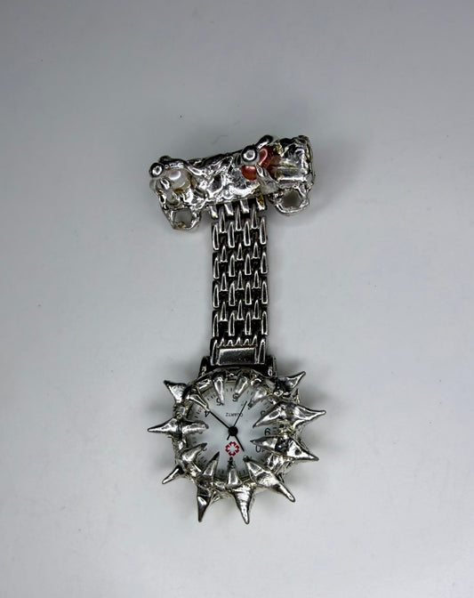 Spiked pearl broach watch